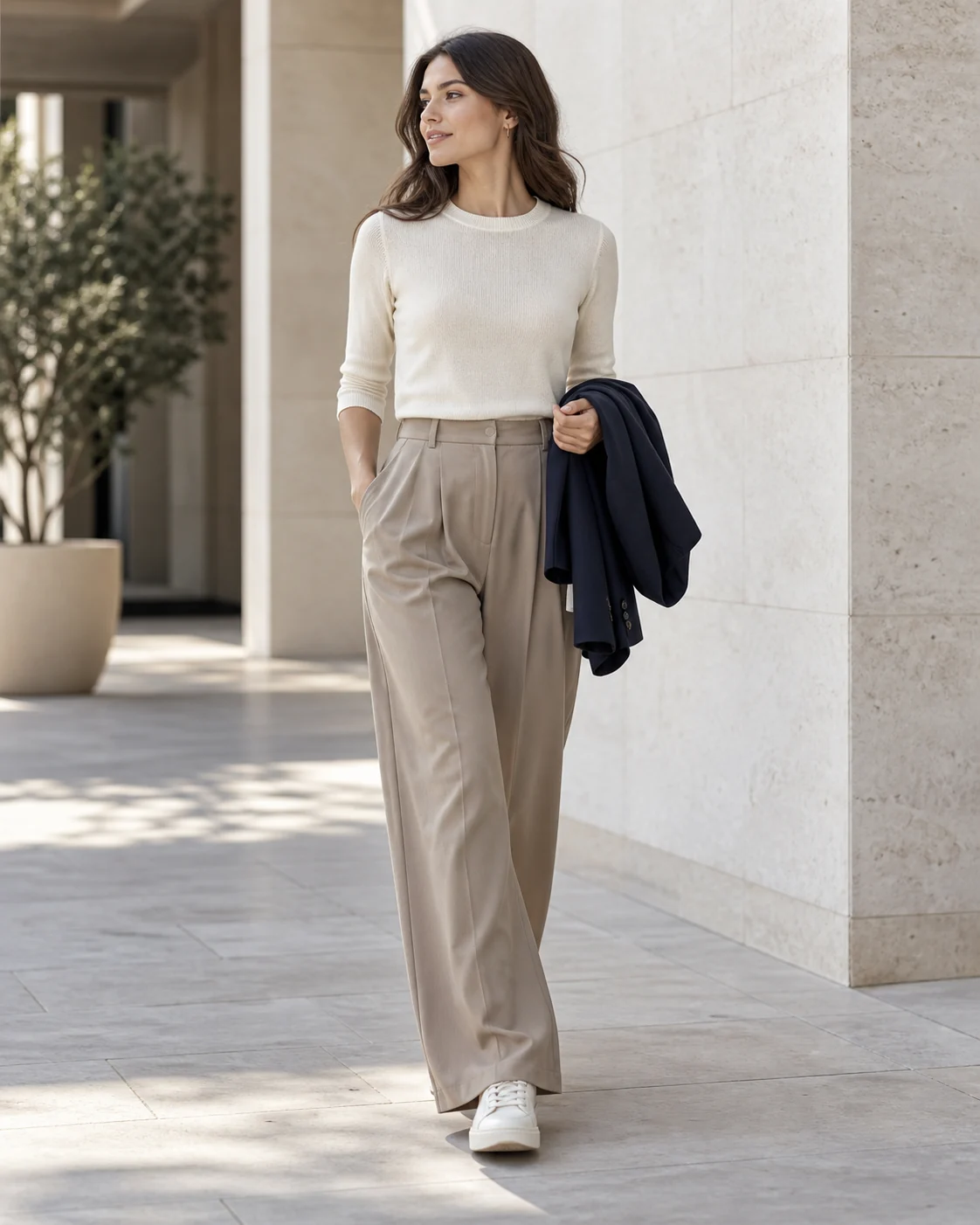 Womenswear outfit with ivory knit top and wide-leg trousers